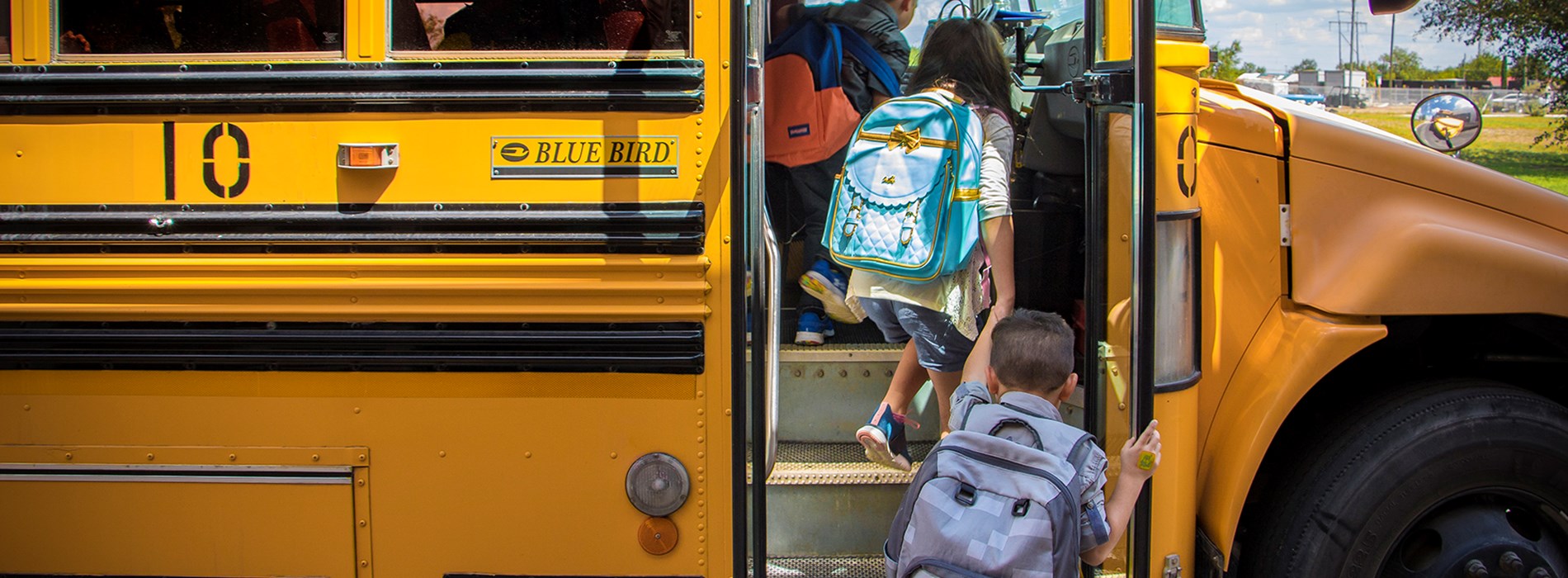 studentsloadingbus.jpg Transportation Banner Image